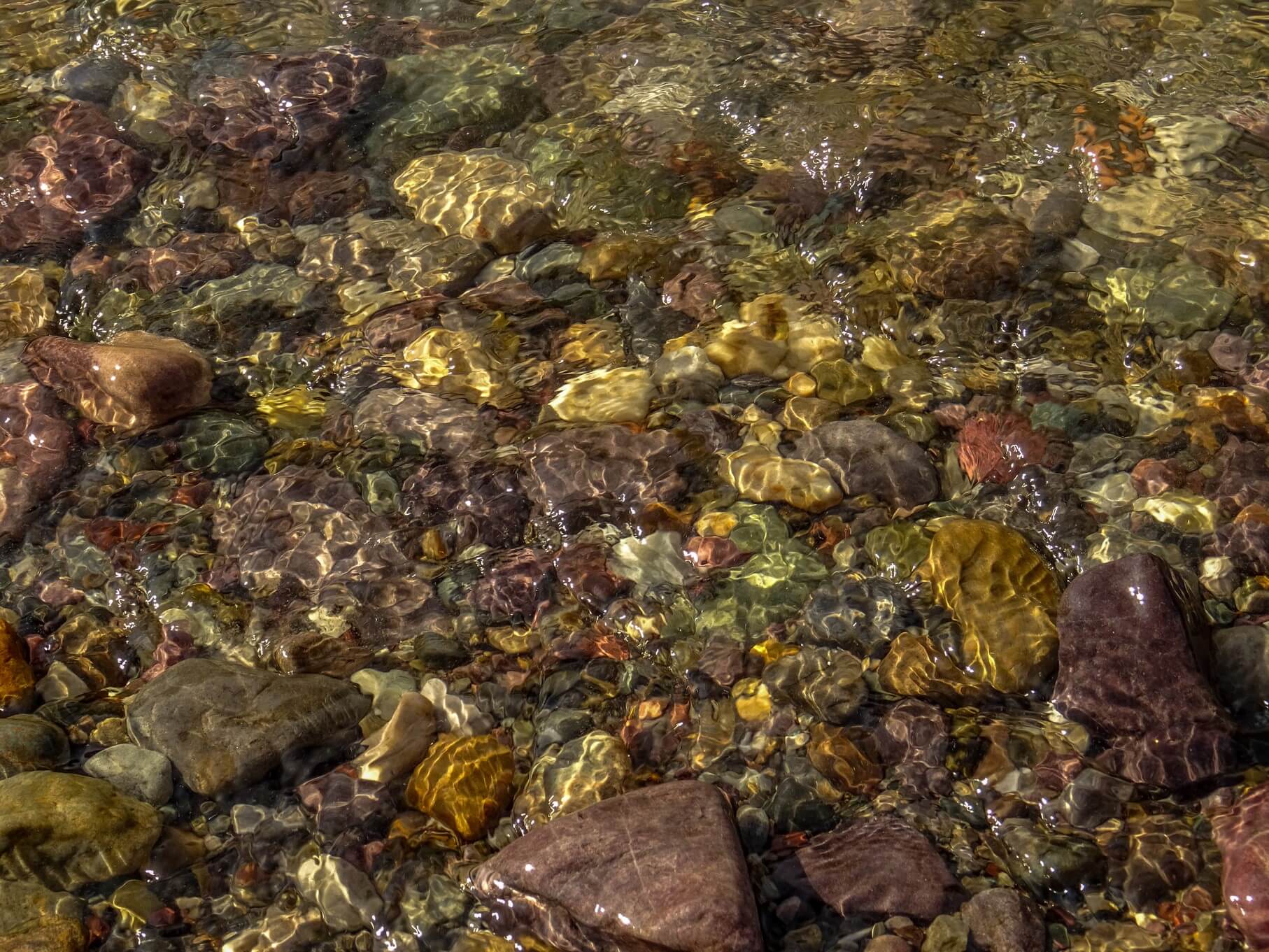 pebbles water reflection Ganges