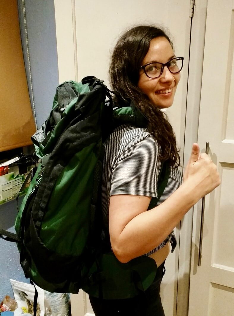 girl with backpack smaller travel footprint