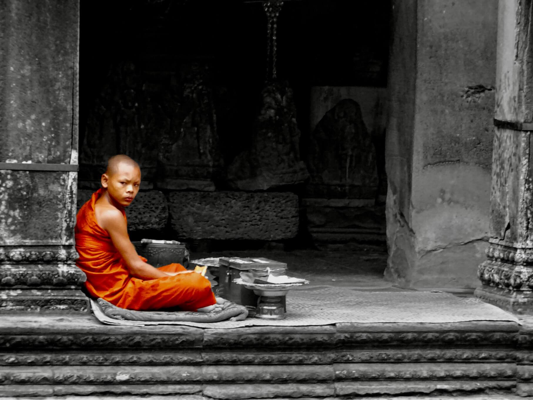 Monk having a quiet moment at Angkor Wat
